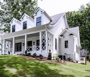 Modern Farmhouse style Home with large front porch by Waterford Homes in Chamblee, GA